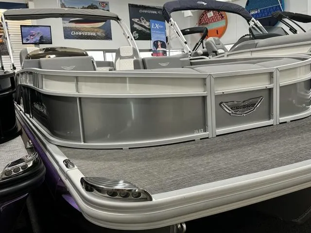 Slide: The Image of 2024 Bennington 25 LTSB pontoon boat, sleek design, silver finish, luxury seating. - 5