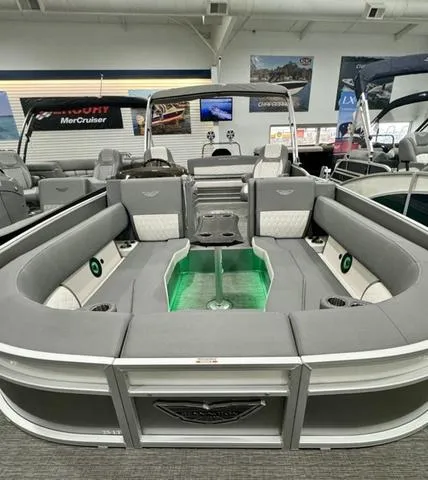 Slide: The Image of 2024 Bennington 25 LTSB pontoon boat with spacious seating and modern interior design. - 9