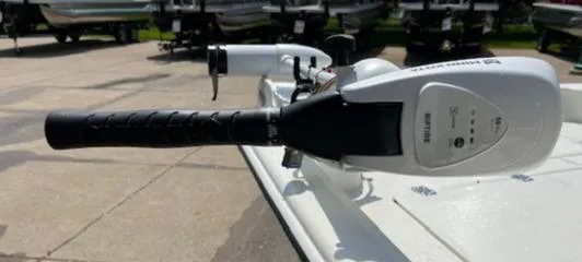 Slide: The Image of Close-up of the control handle on a 2024 Mako Pro Skiff 15 CC boat. - 2