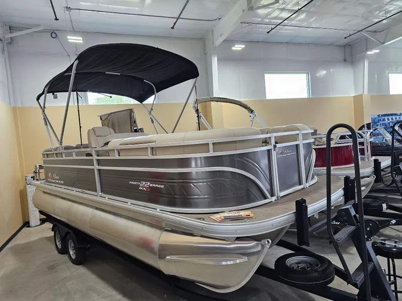 The Image of 2024 Sun Tracker Party Barge 22 RF XP3 pontoon boat in showroom. - 0