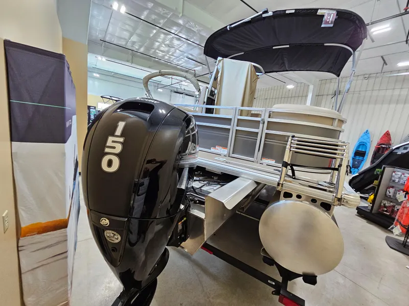 Slide: The Image of 2024 Sun Tracker Party Barge 22 RF XP3 with 150 HP engine in showroom. - 2