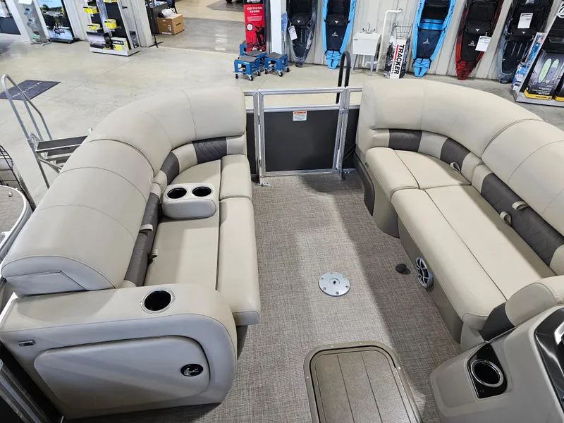 Slide: The Image of 2024 Sun Tracker Party Barge 22 RF XP3 interior with plush seating and cup holders. - 9