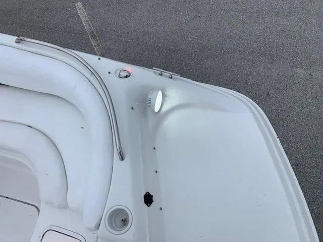 Slide: The Image of 2004 Hurricane 187SD boat interior with seating and light. - 13