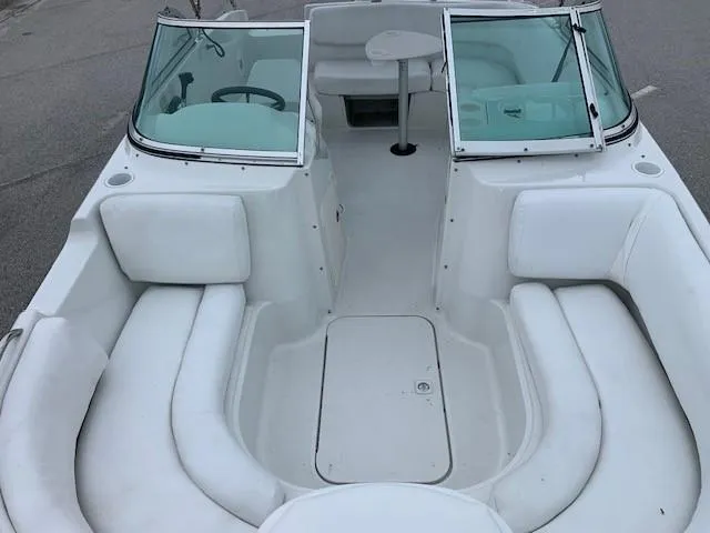 Slide: The Image of 2004 Hurricane 187SD boat interior with white seating and windshield. - 14