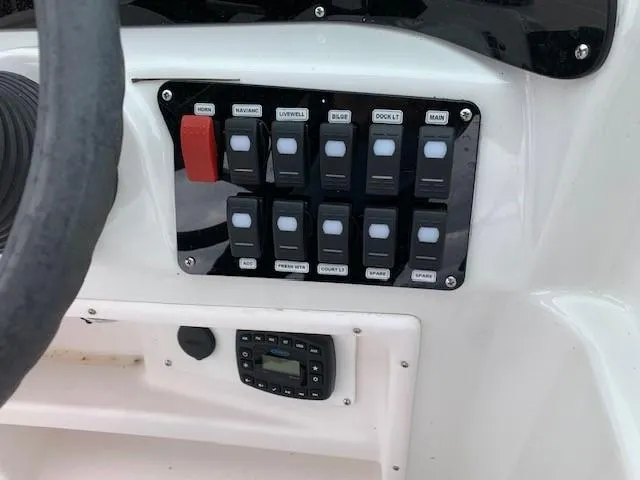 Slide: The Image of Control panel, 2004 Hurricane 187SD boat with various switches and a digital display. - 17