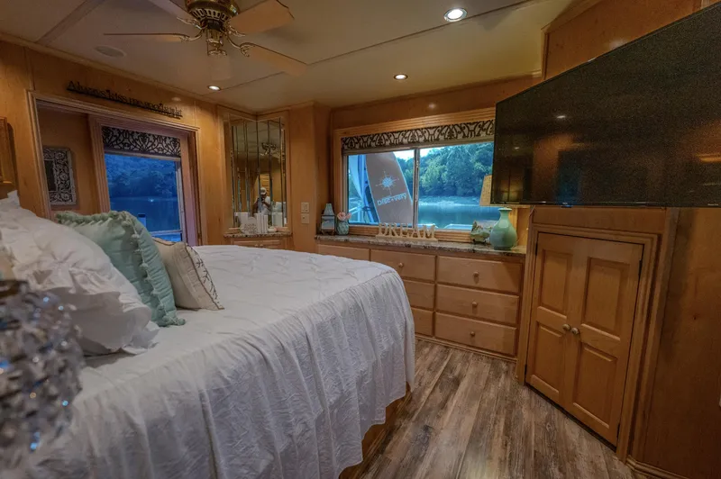 Slide: The Image of Luxurious bedroom in 2007 Fantasy houseboat with elegant decor and scenic window view. - 21