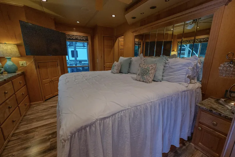 Slide: The Image of Luxurious bedroom in 2007 Fantasy 19 X 90 houseboat with elegant decor and cozy bedding. - 24