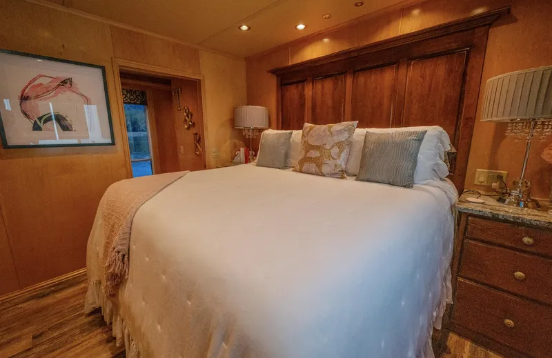 Slide: The Image of Cozy bedroom with a large bed, elegant decor, and warm lighting in a Fantasy 19 X 90 model. - 29