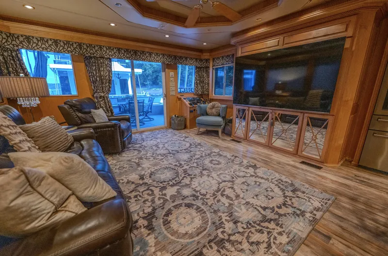 Slide: The Image of Luxurious living room in a 2007 Fantasy 19 X 90 houseboat with elegant decor and large windows. - 38