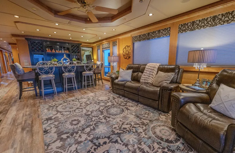 Slide: The Image of Luxurious RV interior with leather seating, elegant decor, and a stylish bar area. - 40