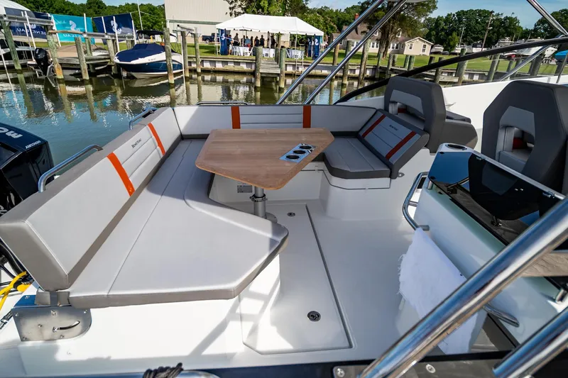Slide: The Image of 2024 Beneteau Flyer 10 boat with spacious seating and table on deck. - 15