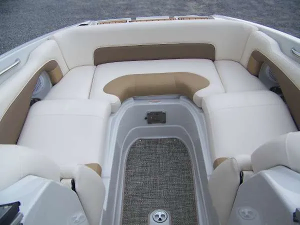 Slide: The Image of 2016 Crownline E4 boat interior with beige and white seating. - 10