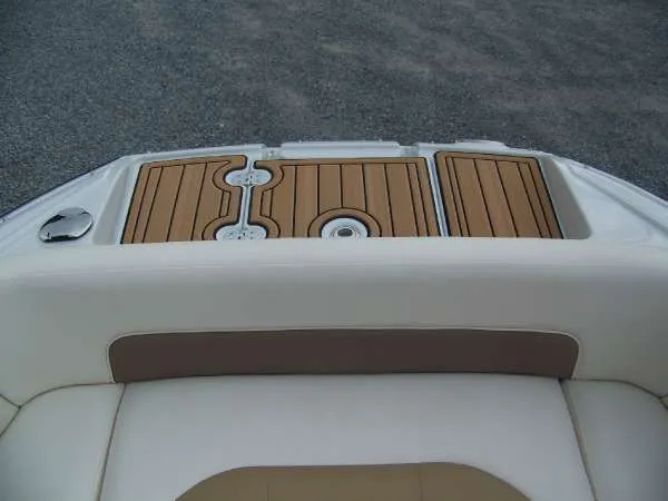 Slide: The Image of 2016 Crownline E4 boat with teak-style swim platform and cushioned seating. - 12