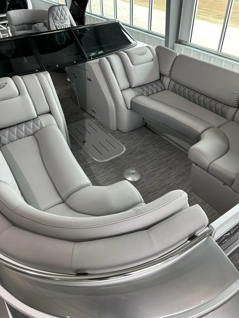 Slide: The Image of Luxurious interior of the 2024 Bennington 27 QFBA pontoon boat with plush seating. - 10