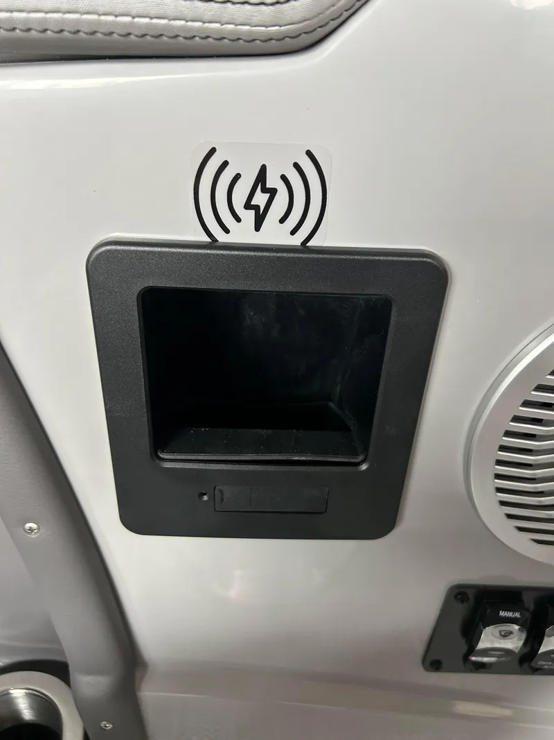 Slide: The Image of Built-in wireless charging station on the 2024 Bennington 27 QFBA boat. - 13
