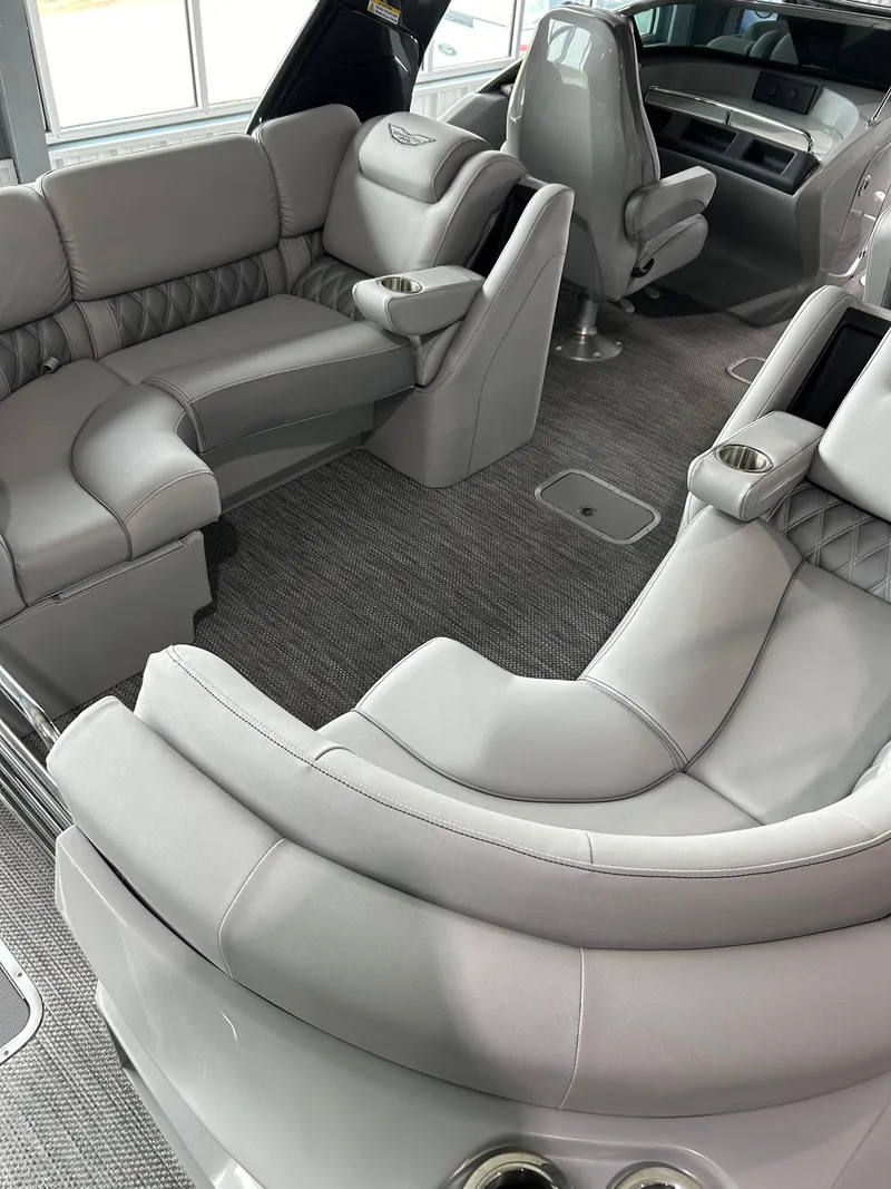 Slide: The Image of 2024 Bennington 27 QFBA luxury boat interior with plush seating and modern design. - 5
