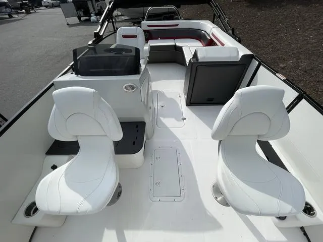 Slide: The Image of 2023 Hurricane FunDeck 1960 REF OB boat interior with white seating and helm. - 8