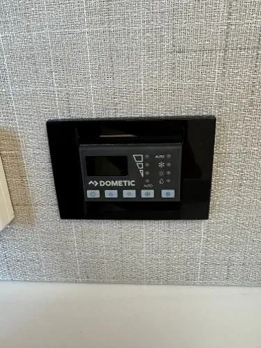 Slide: The Image of Dometic control panel in 2023 Regal LS36 boat interior. - 17