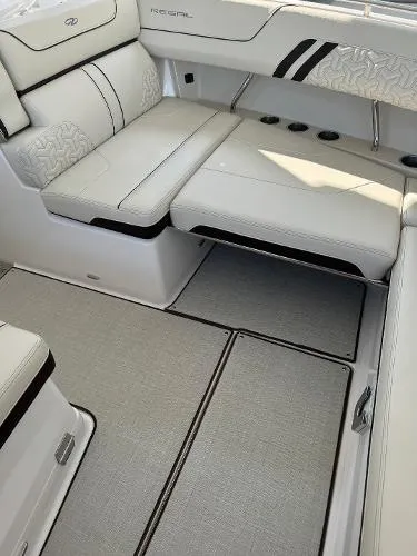 Slide: The Image of 2023 Regal LS36 boat interior with luxurious white seating and modern design. - 20