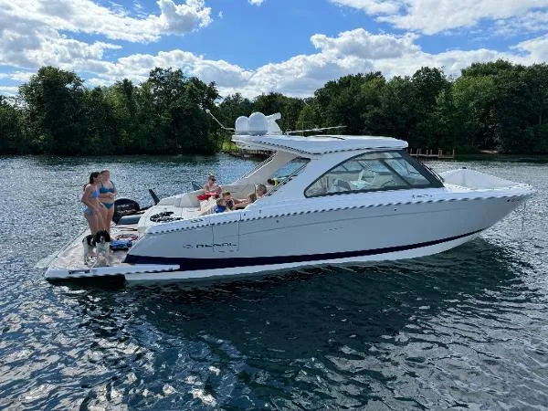 Slide: The Image of 2023 Regal LS36 boat on a lake with people enjoying the sun. - 3