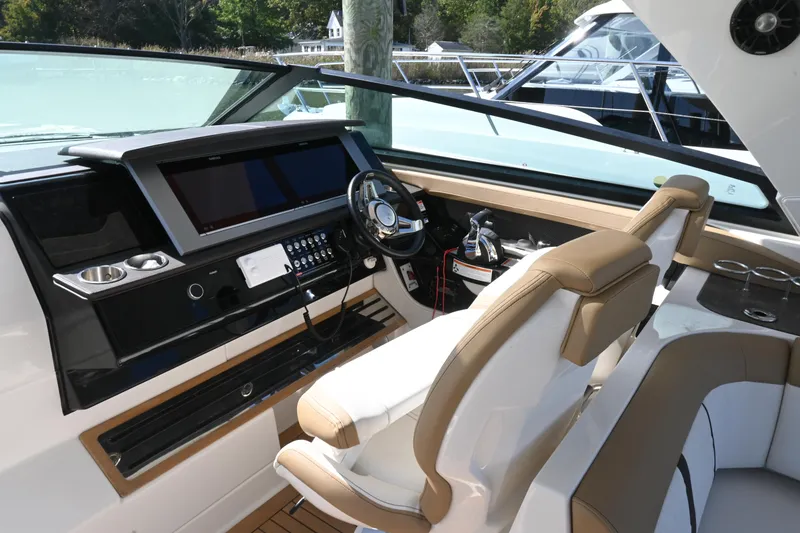 Slide: The Image of 2019 Sea Ray SLX 400 luxury boat interior with spacious seating and modern amenities. - 11