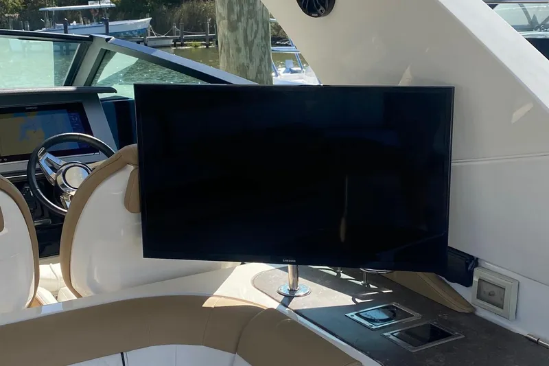 Slide: The Image of 2019 Sea Ray SLX 400 helm with modern controls and luxurious seating. - 12