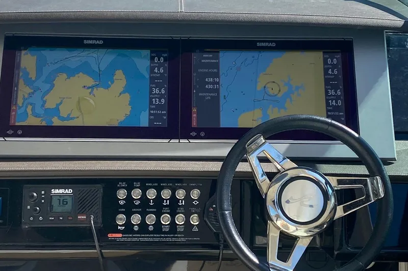 Slide: The Image of 2019 Sea Ray SLX 400 boat interior with mounted TV and luxurious seating. - 13