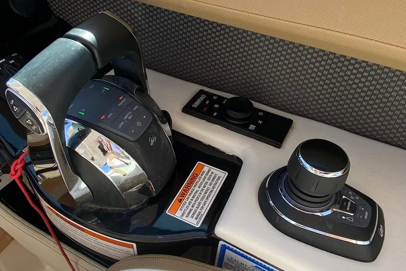 Slide: The Image of Simrad and Fusion marine electronics on 2019 Sea Ray SLX 400 dashboard. - 15