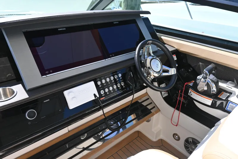 Slide: The Image of Control panel of 2019 Sea Ray SLX 400 boat with joystick and throttle. - 16