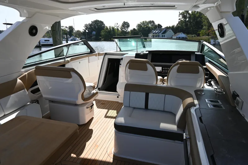 Slide: The Image of 2019 Sea Ray SLX 400 boat interior with luxurious seating and modern dashboard. - 18
