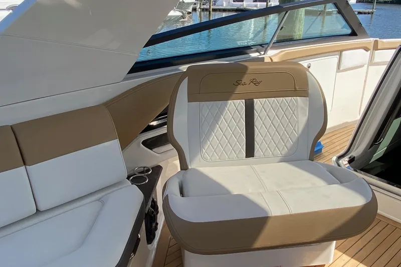 Slide: The Image of Luxurious 2019 Sea Ray SLX 400 yacht interior with elegant seating and wooden flooring. - 20