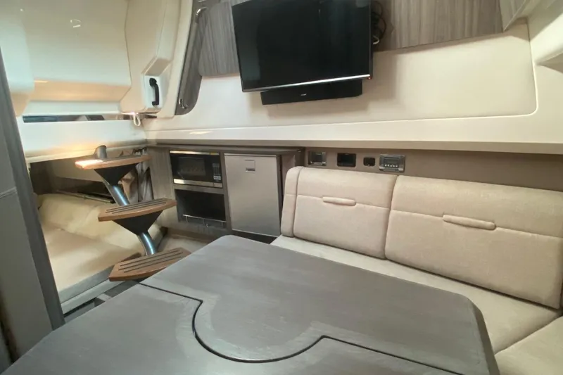 Slide: The Image of Luxurious 2019 Sea Ray SLX 400 interior with plush seating and modern table design. - 39