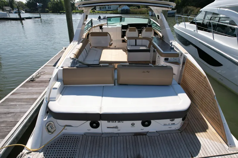 Slide: The Image of 2019 Sea Ray SLX 400 luxury boat docked in marina. - 4