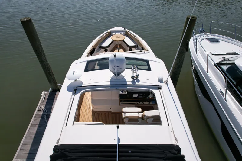 Slide: The Image of 2019 Sea Ray SLX 400 luxury boat docked, featuring spacious seating and sleek design. - 5
