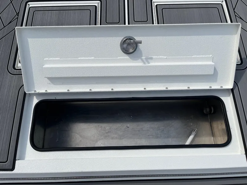 Slide: The Image of Open storage compartment on 2024 Avid 20 Rogue boat. - 10