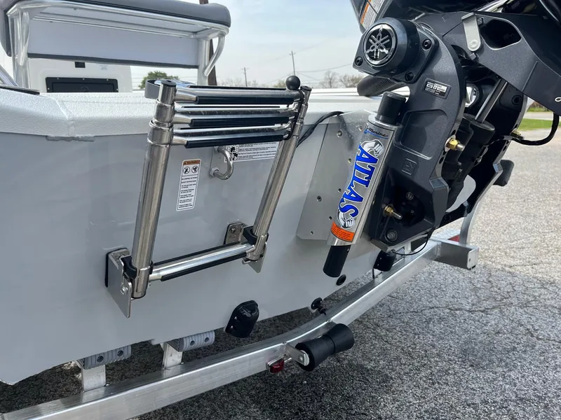 Slide: The Image of 2024 Avid 20 Rogue boat with Atlas hydraulic jack plate and stainless steel ladder. - 11