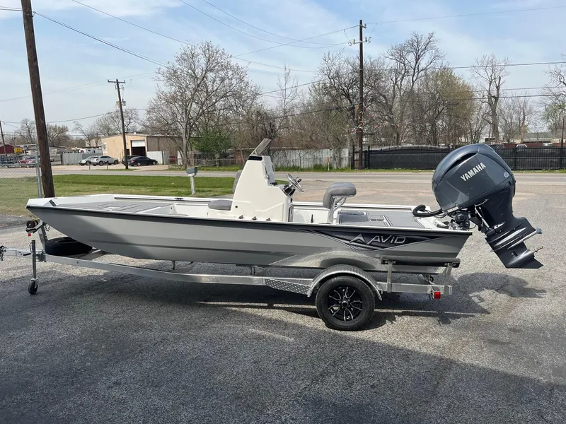 Slide: The Image of 2024 Avid 20 Rogue boat with Yamaha outboard motor on a trailer. - 3