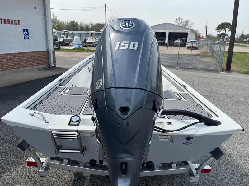 Slide: The Image of 2024 Avid 20 Rogue boat with Yamaha 150 outboard motor in storage facility. - 7