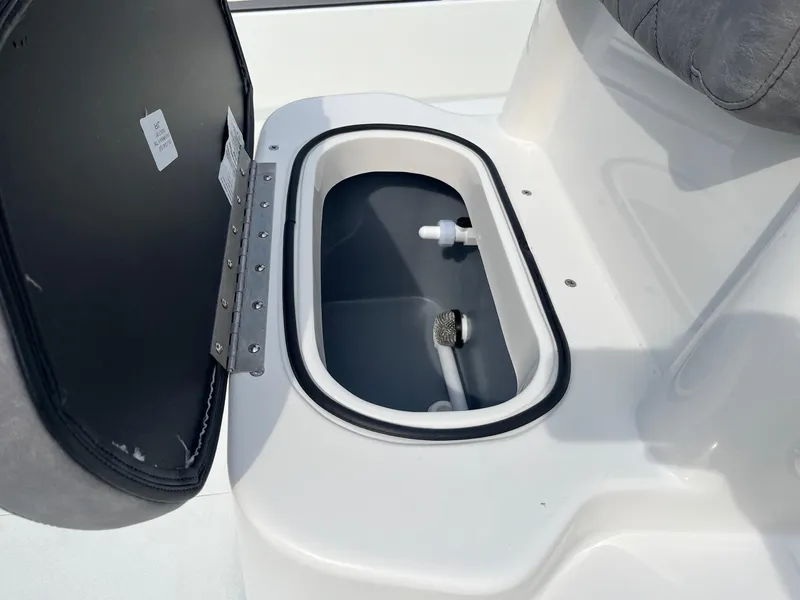 Slide: The Image of Open storage compartment in 2024 Avid 20 Rogue boat. - 9