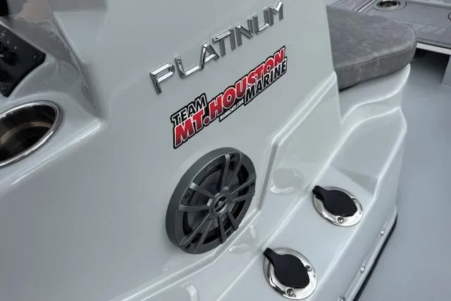 Slide: The Image of 2024 Avid 23 Fusion boat interior with speaker and branding decals. - 15