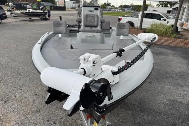 Slide: The Image of 2024 Avid 23 Fusion boat with trolling motor, parked on a concrete surface. - 7