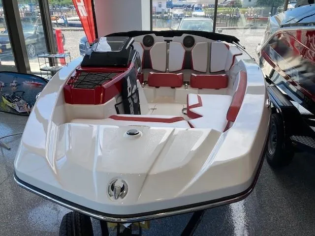 Slide: The Image of 2022 Scarab 165 boat with red and white interior on display. - 3