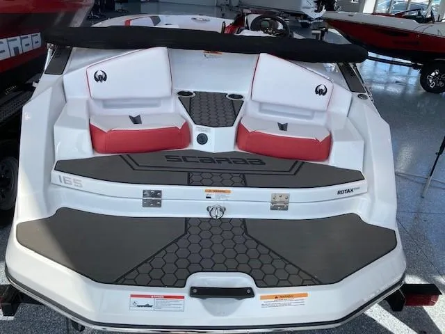 Slide: The Image of 2022 Scarab 165 boat rear view with seating and deck. - 4