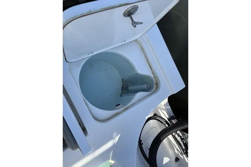 Slide: The Image of Open storage compartment on 2023 Sea Pro 208 Bay boat, showing interior details. - 16