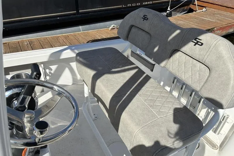 Slide: The Image of 2023 Sea Pro 208 Bay boat interior with dual seats and steering wheel. - 21