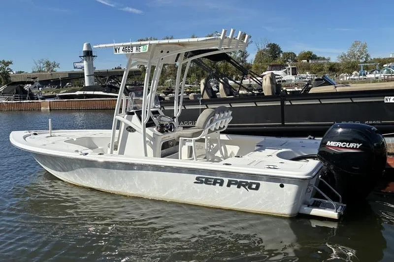 Slide: The Image of 2023 Sea Pro 208 Bay boat with Mercury engine docked in marina. - 32