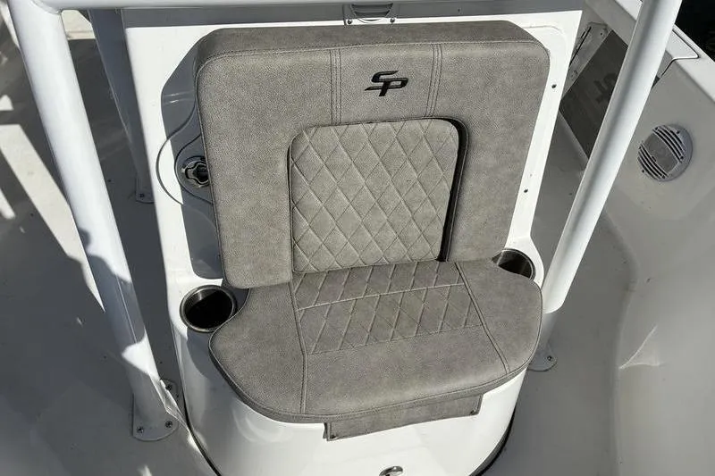 Slide: The Image of Gray cushioned seat on 2023 Sea Pro 208 Bay boat, featuring diamond stitching and cup holders. - 34