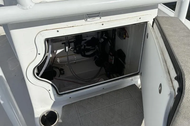 Slide: The Image of Open storage compartment on a 2023 Sea Pro 208 Bay boat, showing interior details. - 35