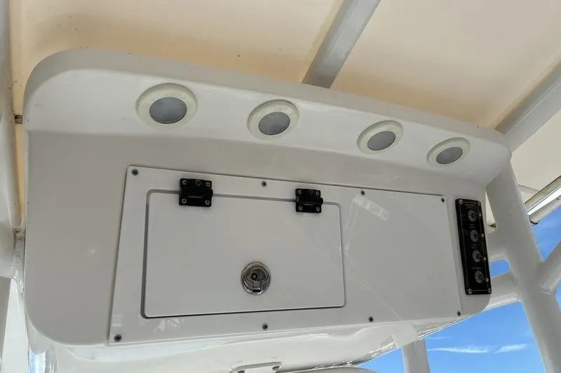 Slide: The Image of 2023 Sea Pro 208 Bay boat console with storage compartment and circular lights. - 37