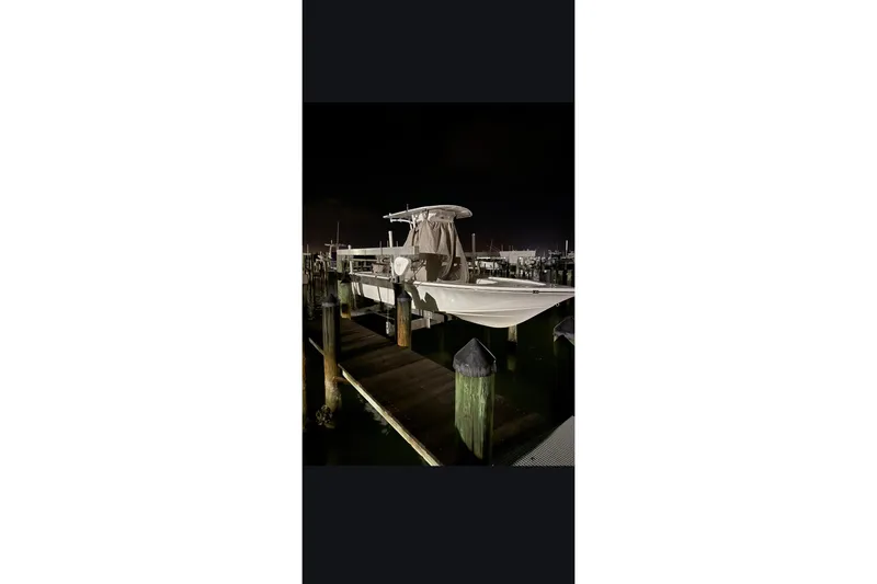 Slide: The Image of 2023 Sea Pro 208 Bay boat docked at night. - 9